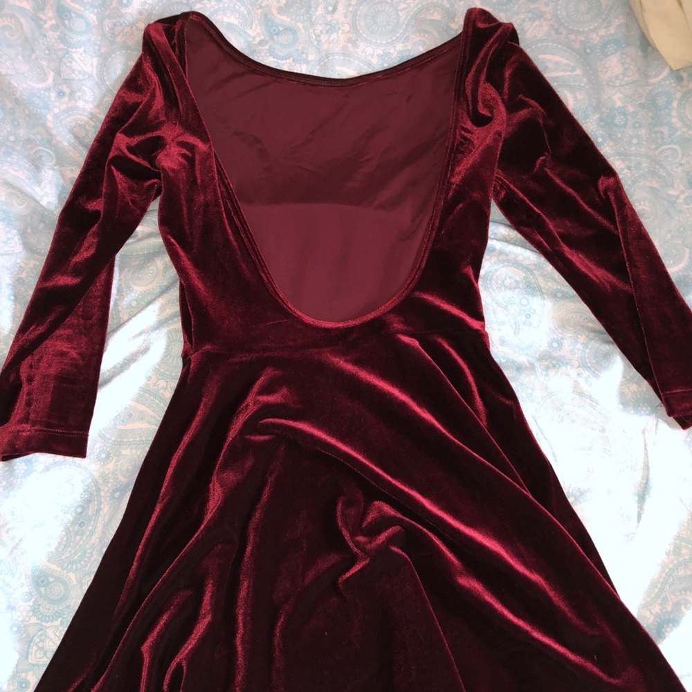 Deep red velvet scoop back dress above the knees